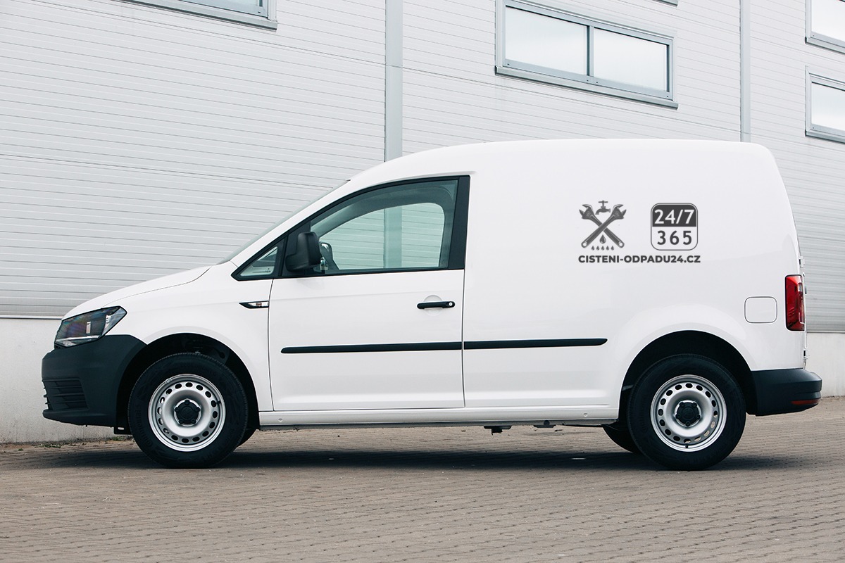 Volkswagen Caddy near warehouse wall